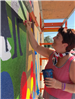 Woman Working on Mural